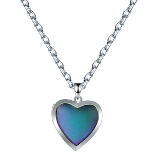 Detail view of heart locket pendant with color changing insert on stainless steel chain