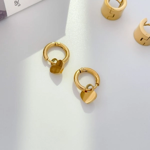 Polished gold heart drop hoop earrings with reflective mirror finish and modern style