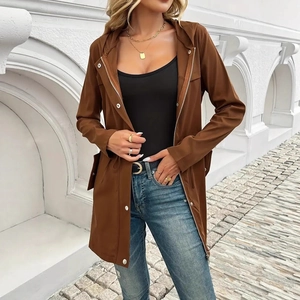 Detail of caramel brown hooded windbreaker jacket with zipper and silver button closure