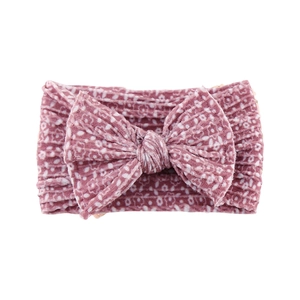Detail of pink corduroy baby headband featuring a soft texture and a stylish bow knot