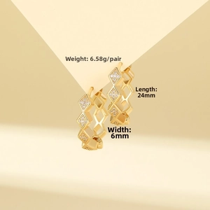 Detail showing gold geometric rhombus earrings with zircons measuring 24mm by 6mm