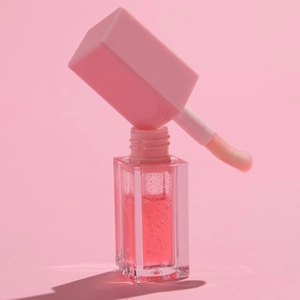 Pink water-light mirror lip glaze in transparent square glass bottle with sponge applicator