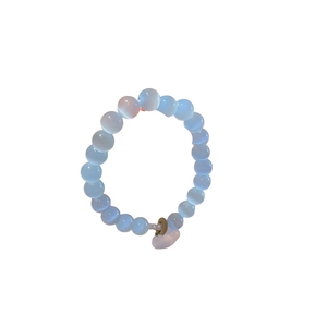 Cat eye opal and black agate beaded bracelet with a pink heart pendant in soft light blue