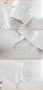 Detailansicht der Rippbündchen und Blumenstickerei auf grauem Mädchen-Sweatshirt