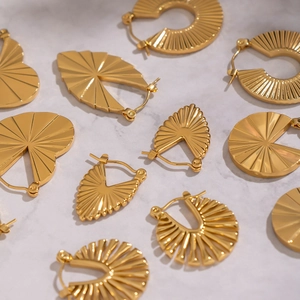 Vintage geometric gold plated earrings set with sunburst texture in heart and round shapes