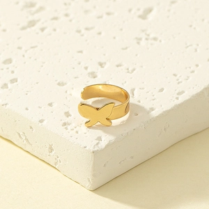 Fashionable golden butterfly nose ring and non-pierced cuff on white stone base