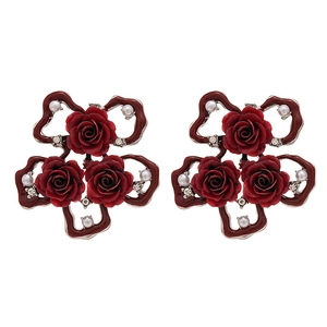 Vintage red rose stud earrings with pearls and crystals on a clean white background