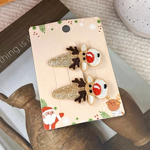 Detail von Weihnachts-Rentier-Haarspangen mit Goldglitzer und 3D-Stickerei auf Karte