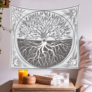 Macro detail of Bohemian Tree of Life tapestry fabric with mystic sun and moon patterns
