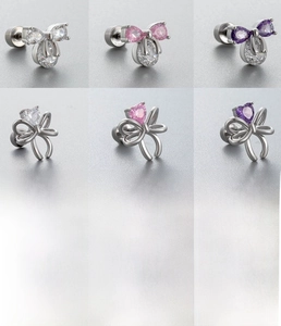 Detailed view of cubic zirconia bow stud earrings in heart and teardrop shapes
