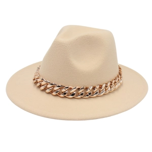 Close-up of the beige fedora hat featuring a chunky gold acrylic chain decoration
