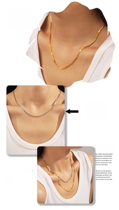 Flat blade snake chain necklaces in gold and silver finish shown on a model