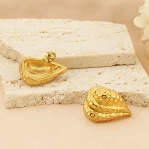 Detailed macro view of 18k gold plated stainless steel stud earrings with hammered texture