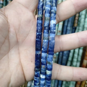 Macro detail of cylindrical natural blue stone beads for DIY jewelry accessories