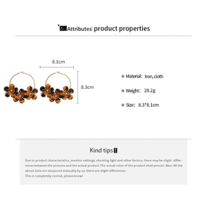 Detailed view of leopard print fabric flower earrings with iron ring and measurements