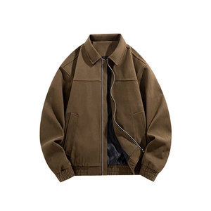 Detail of dark brown men's jacket with classic collar, silver zipper and ribbed cuffs
