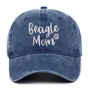 Close-up of white Beagle Mom embroidery and dog paw detail on washed blue denim cap
