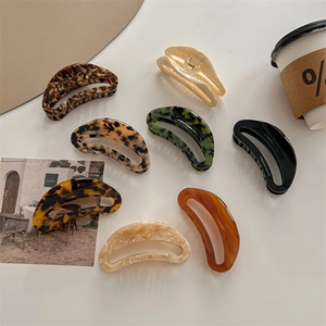 Oversized hollow acetate shark hair clips in tortoiseshell and marble patterns
