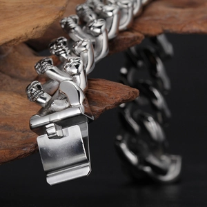Men's punk double row skull chain bracelet in silver titanium steel with wood background