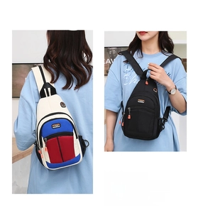 Detail of versatile sports chest bags with dual zipper compartments and side mesh pockets