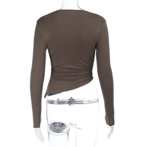 Detail showing the ruching design and asymmetrical hem of a brown long sleeve top