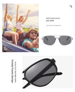 Close-up of stylish double bridge sunglasses with gray lenses and thick black frames