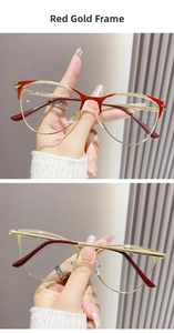 Detail of red and gold cat-eye glasses frame with textured metal brow and luxury finish