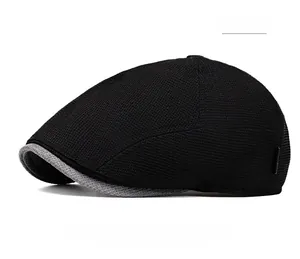 Detail of black mesh newsboy cap with breathable fabric and grey contrast brim trim