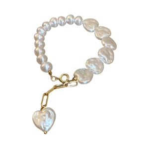 Irregular pearl bracelet with heart charms and golden T-bar toggle clasp for women