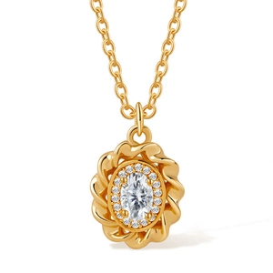 Detailed close-up of 18K gold flower pendant with central white stone and zircon stones
