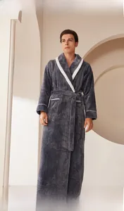 Detail of men's dark gray flannel bathrobe with quilted diamond texture and white lapels