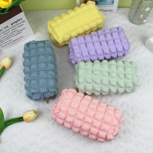 Quilted bubble texture pencil cases in pastel colors for school and cosmetic storage