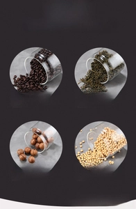 Detail of borosilicate glass vacuum jars storing coffee beans, tea and nuts