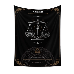 Detail of Libra zodiac tapestry featuring gold and white celestial lines on black fabric