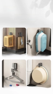 Detailed view of stainless steel retractable hooks holding baskets and basins on the wall