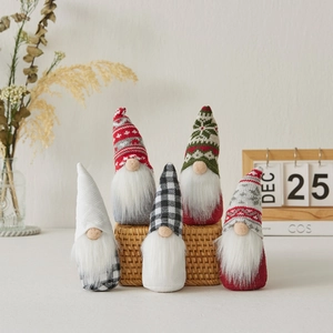 Set of 5 Christmas gnomes with snowflake knit hats in various festive colors on display