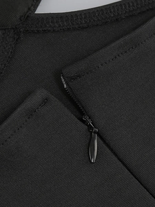 Detailed macro shot of the invisible zipper and high-quality black fabric texture