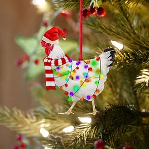 Detail of creative Christmas chicken ornament with red scarf and hat on a festive tree