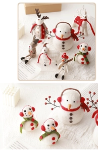 Detailed view of handmade wool felt Christmas ornaments featuring a white snowman and reindeer