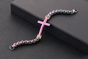 Close-up of rainbow stainless steel cross bracelet on a black jewelry gift box