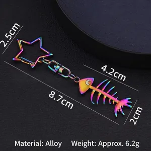 Rainbow plated fishbone keychain with star hook on black leather background