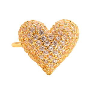 Macro detail of gold plated heart ring with pave set cubic zirconia crystals