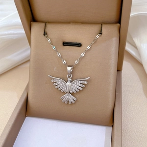 Detail of silver phoenix necklace with sparkling zircons inside a luxury jewelry gift box