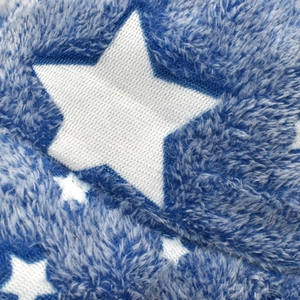 Macro shot of navy blue plush fabric with white star pattern and soft texture