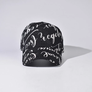 Detailed close-up of a black baseball cap with all-over white cursive script pattern