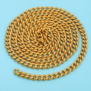 Golden stainless steel Cuban link chain accessory on light blue background for jewelry DIY