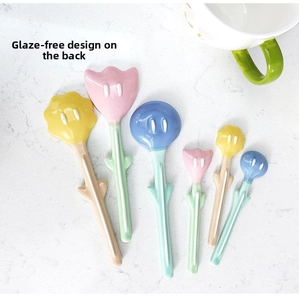 Macro detail of tulip ceramic spoon set showing the unglazed non-slip back and flower design