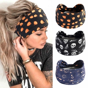 Detailed set of wide headbands with Halloween pumpkin, skull, and celestial moon patterns
