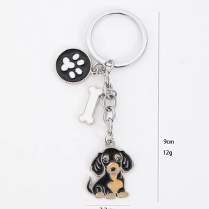American style dachshund metal keychain with bone and paw charms in silver finish