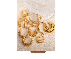 Macro shot of assorted vintage-style 18k gold plated stainless steel hollow hoop earrings